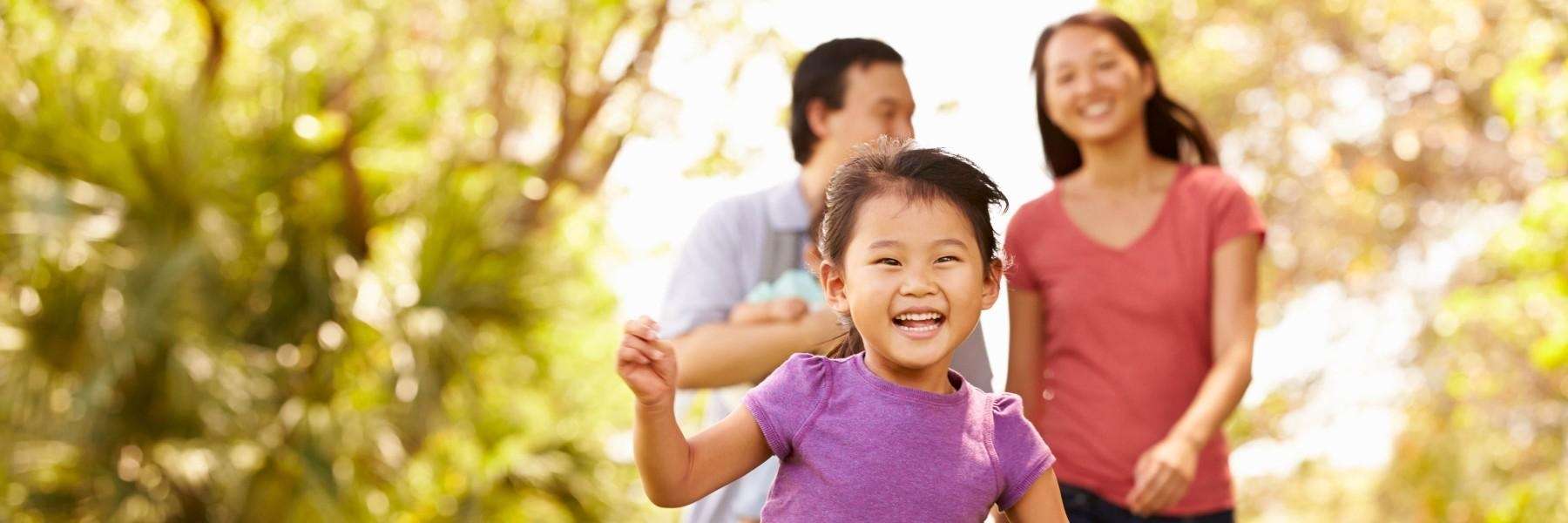 Girl with baby teeth running in Armidale NSW park