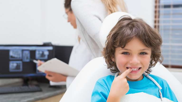 Little boy on a dental chair receiving a dental check up in Armidale NSW