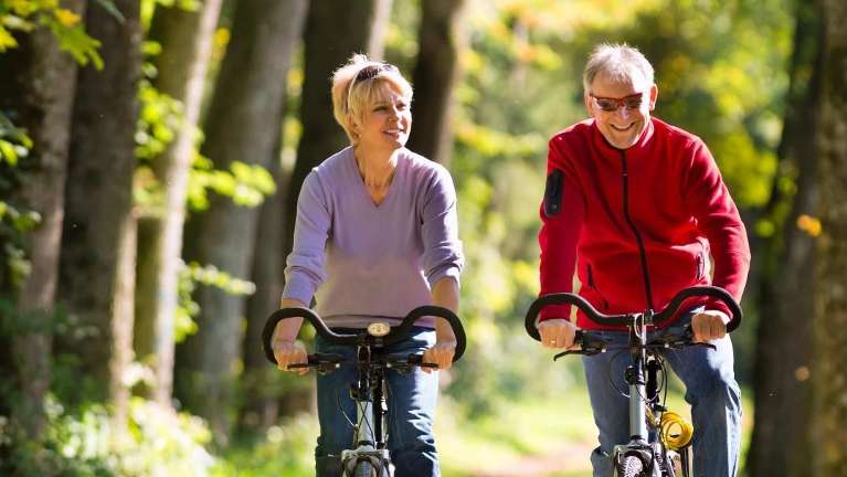Couple biking in Armidal NSW
