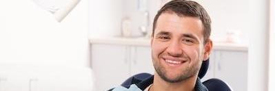 Man smiling in a dentists chair