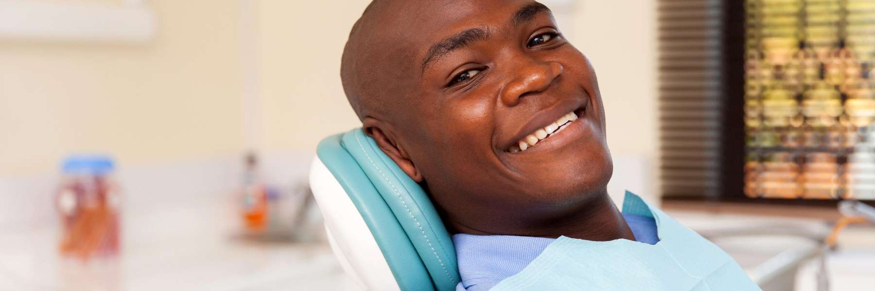 Man smiling in a dentist's office